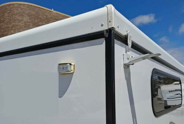 Photo showing protruding over centre latch on pop top caravan